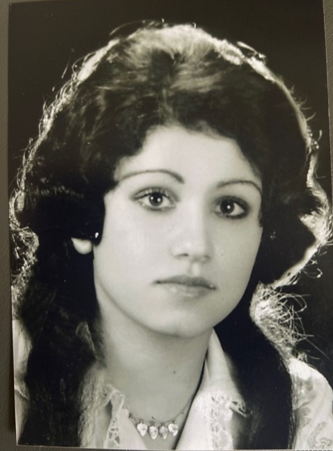 Photograph of the author's grandmother at 18, just after she finished school (description based on the article text).